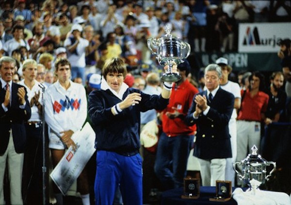 Jimmy Connors Gesturing with His Open Cup Trophy